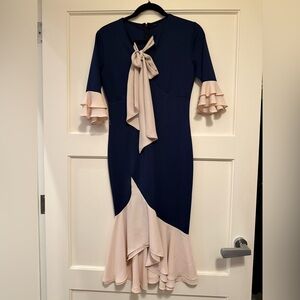 Elegant Navy and Cream Dress with Ruffle Sleeves